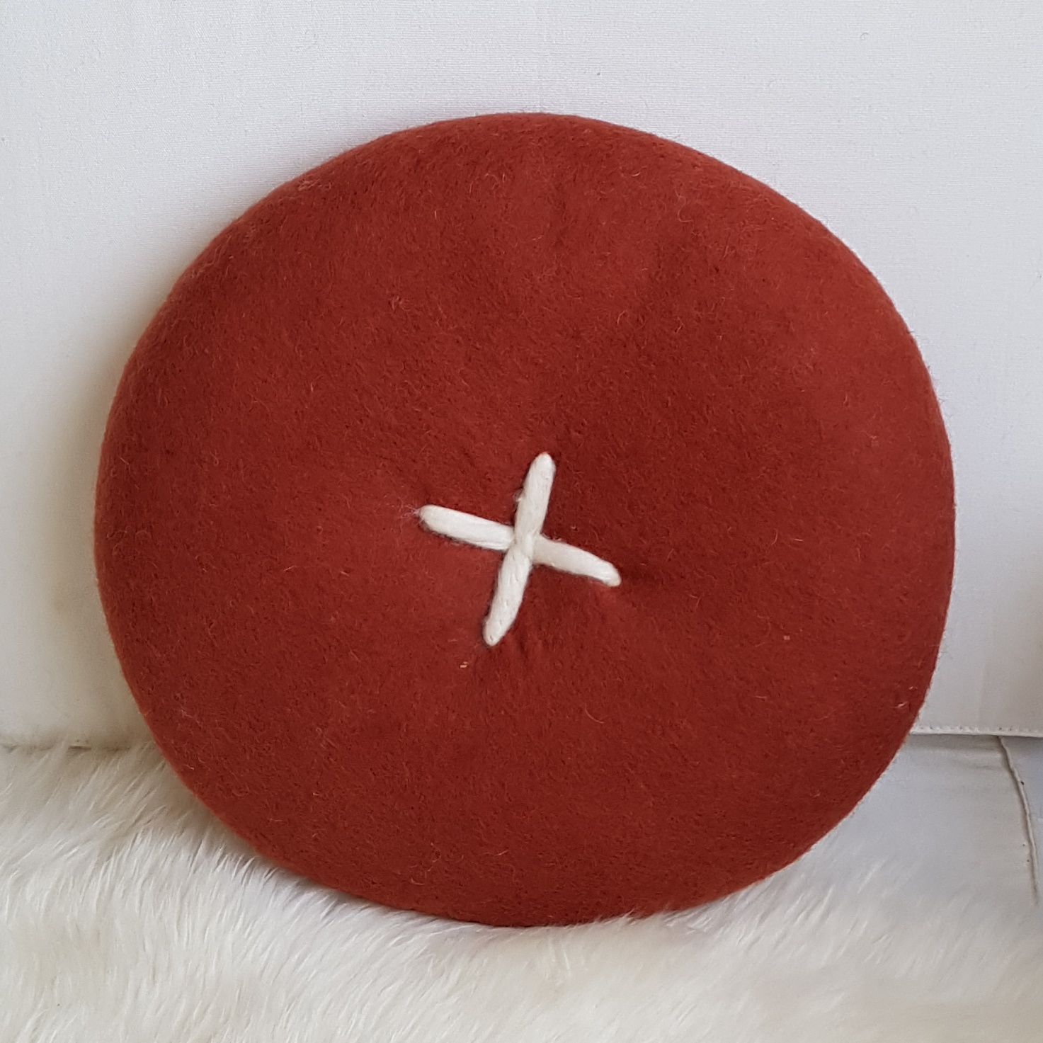 BUTTON CUSHION - RUST